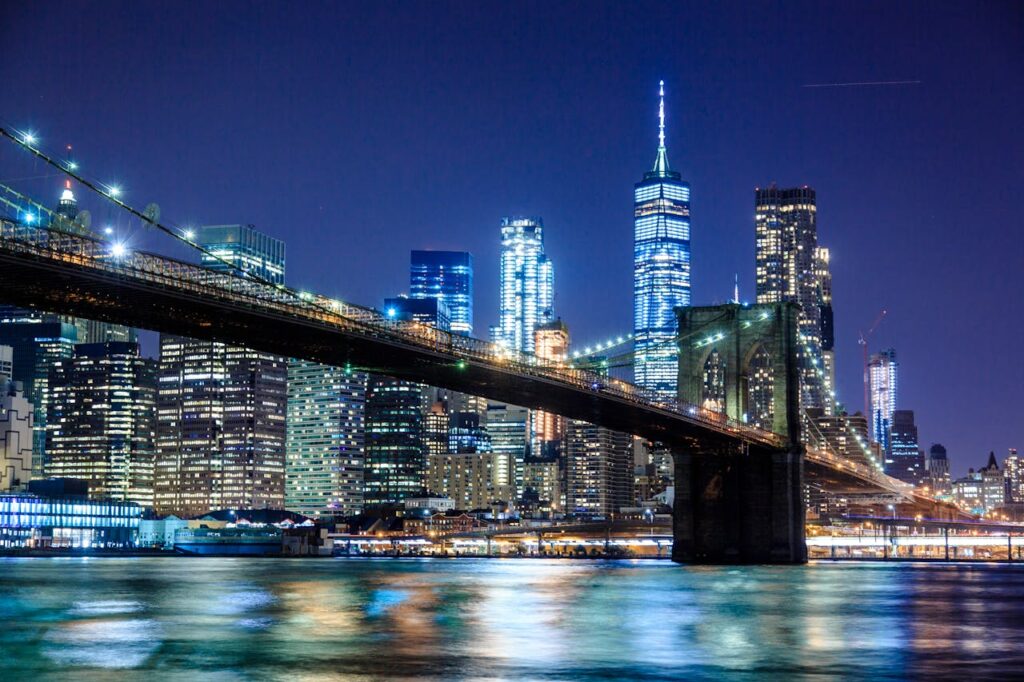 pexels-photo-1239162 Stunning view of the Brooklyn Bridge and New York City skyline illuminated at night.